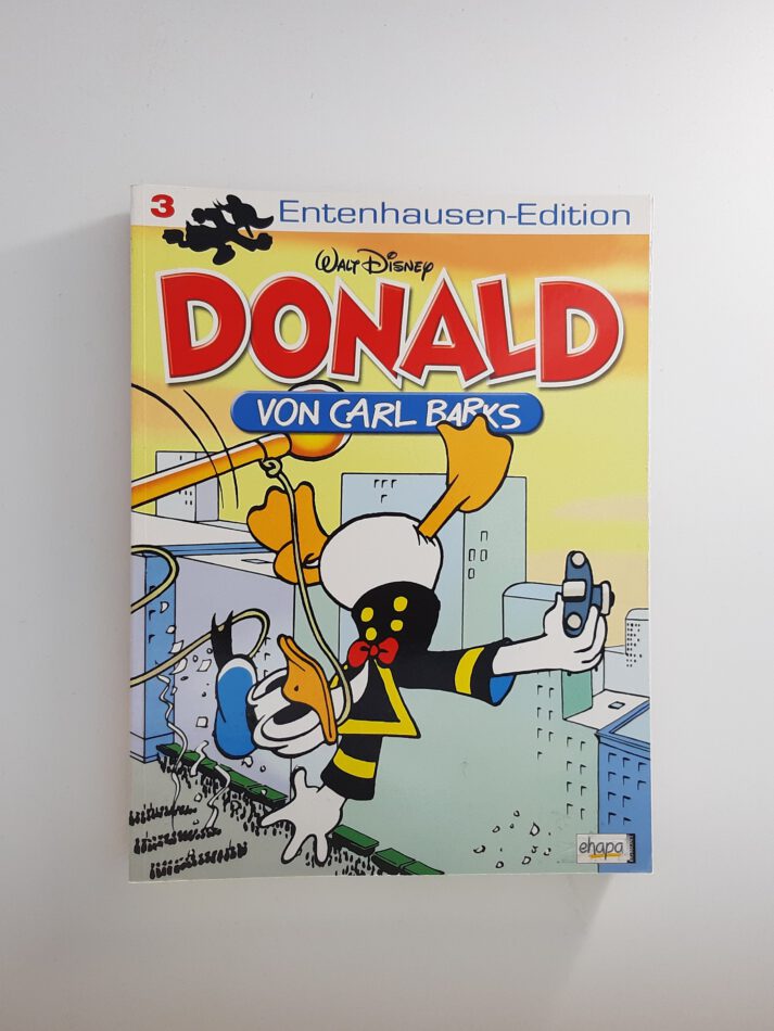 Comic „Donald – Entenhausen-Edition Band 12“ von Carl Barks, Softcover-Ausgabe aus dem Ehapa Verlag, nostalgisches Cover mit Donald Duck in klassischer Pose, neuwertiger Zustand.