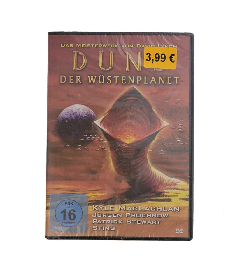 DVD-Cover des Films „Dune – Der Wüstenplanet“ von David Lynch. Zu sehen sind Hauptdarsteller Kyle MacLachlan als Paul Atreides sowie weitere Figuren aus dem Science-Fiction-Epos. Das Artwork zeigt eine düstere Wüstenlandschaft mit mystischen Symbolen und Raumschiffen, passend zur epischen Atmosphäre des Films. Die Gestaltung vermittelt Spannung, Macht und Vision.