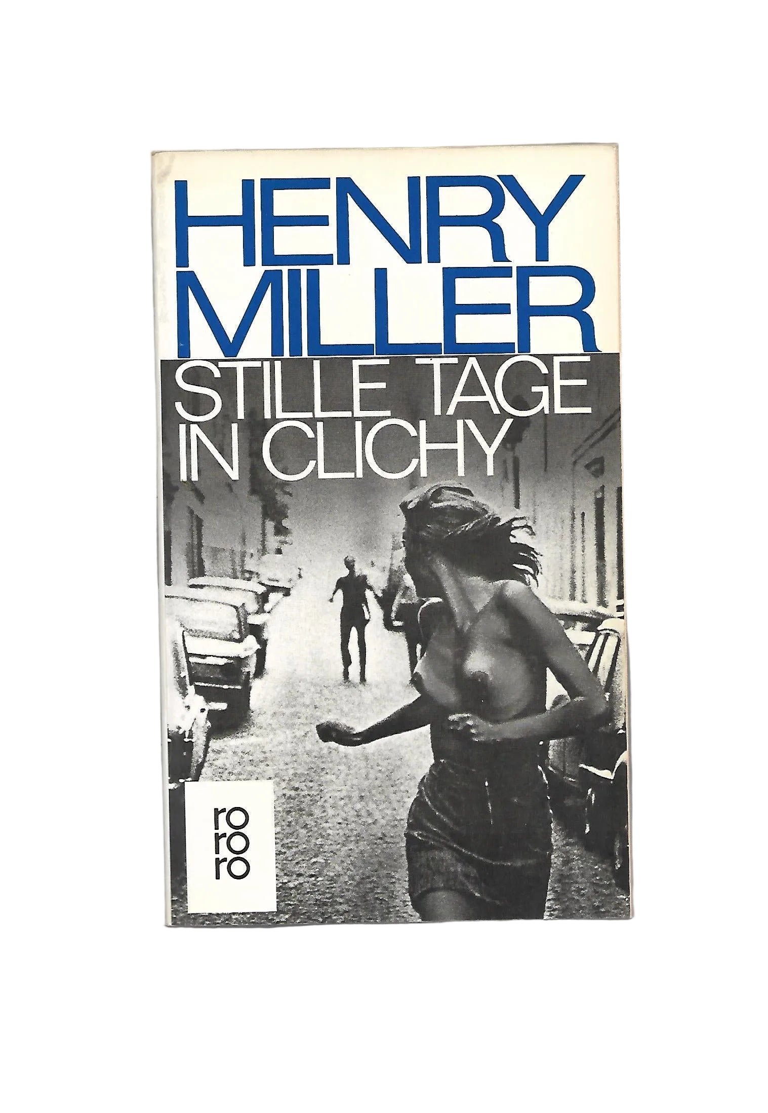 „Buchcover Henry Miller Stille Tage in Clichy, rororo Taschenbuch 1990“ zeigt barbusige Frau flüchtend vor einem Mann - in der Stadt