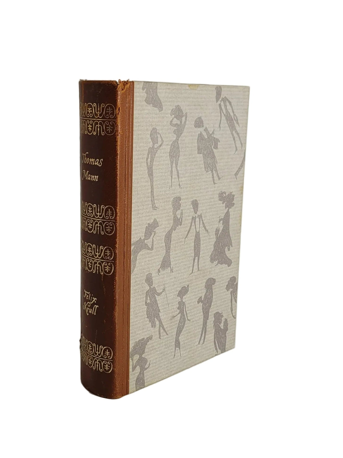 Antiquarisches Buch „Felix Krull“ von Thomas Mann (1954). Gebundene Ausgabe mit braunem, verziertem Buchrücken und hell gemustertem Deckel.