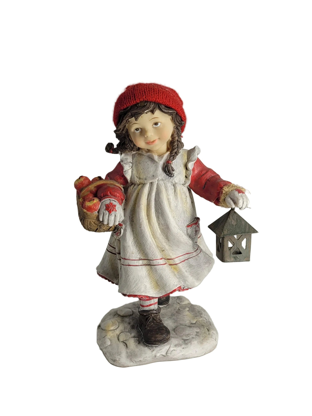 Nostalgische Dekofigur eines Mädchens mit roter Strickmütze, das einen Korb voller Äpfel und eine kleine Laterne trägt (Höhe 20 cm).