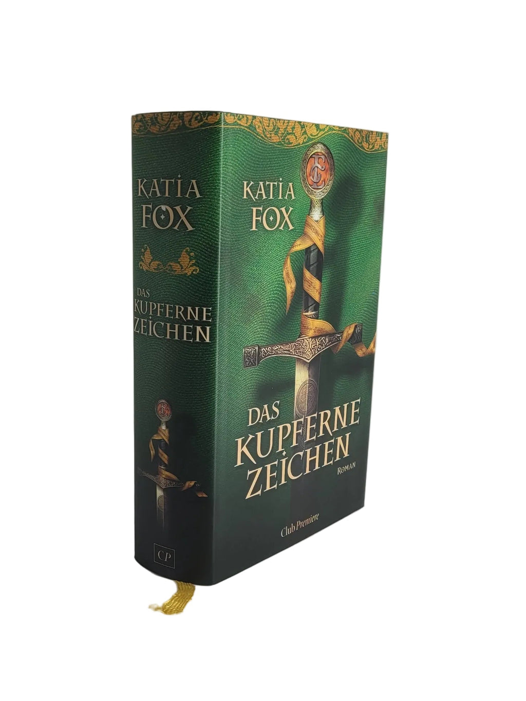 Gebundenes Buch „Das kupferne Zeichen“ von Katia Fox (Club Premiere). Das grüne Cover zeigt ein langes Schwert mit vergoldetem Griff und einem gelben Band.