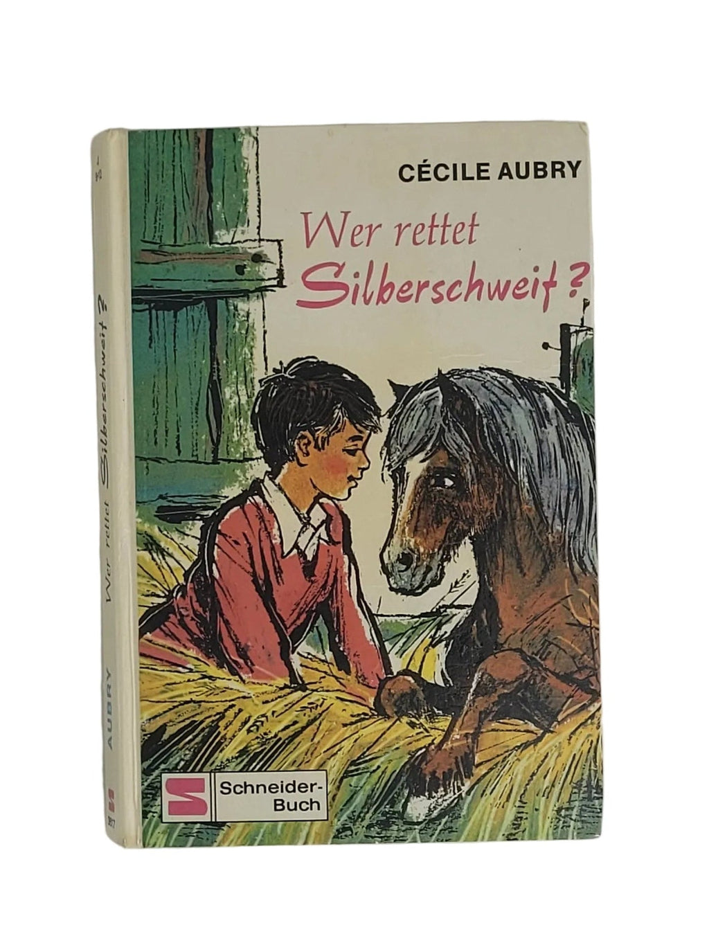 Hardcover-Buchcover von Cécile Aubrys „Wer rettet Silberschweif?“ mit der Zeichnung eines Jungen im Stroh neben einem Pony sowie gelbe Rückseite mit Beschreibungstext.