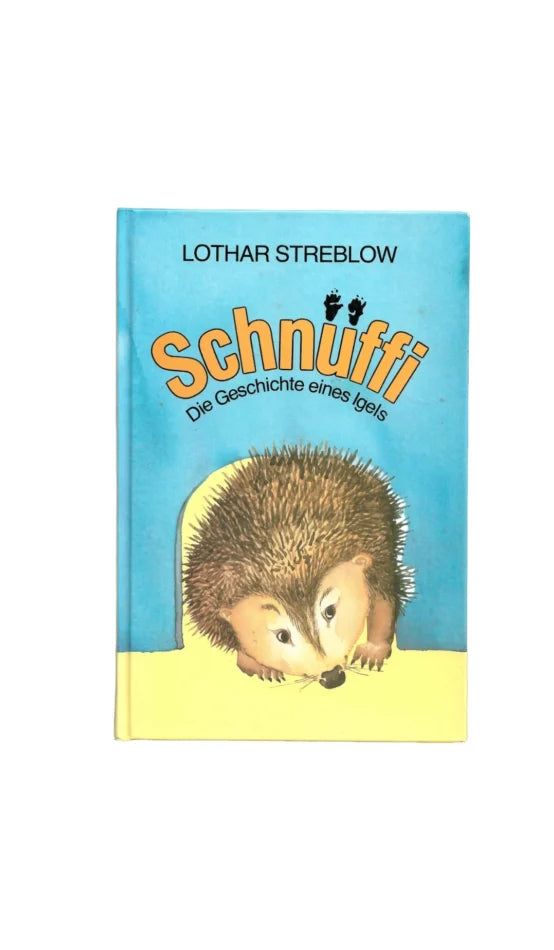 „Schnuffi – Die Geschichte eines Igels, Lothar Streblow, Kinderbuch mit Igelillustration, blauer Hintergrund, orangefarbener Titel.“