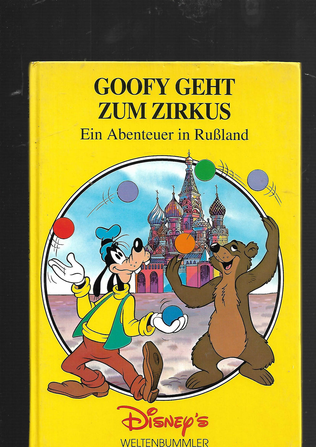 Kinderbuch „Disney's Weltenbummler – Goofy geht zum Zirkus: Ein Abenteuer in Rußland“, Horizont Verlag 1993, farbig illustrierter Einband mit Disney-Figur Goofy in einer Zirkus- und Reiseszene.