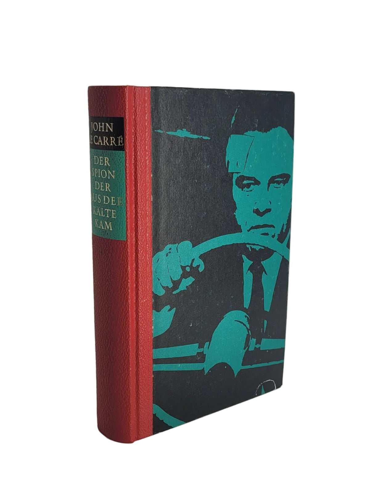 Klassische Hardcover-Ausgabe des Romans „Der Spion, der aus der Kälte kam“ von John le Carré aus dem Bertelsmann Verlag mit rotem Buchrücken und markantem schwarz-türkisen Cover.