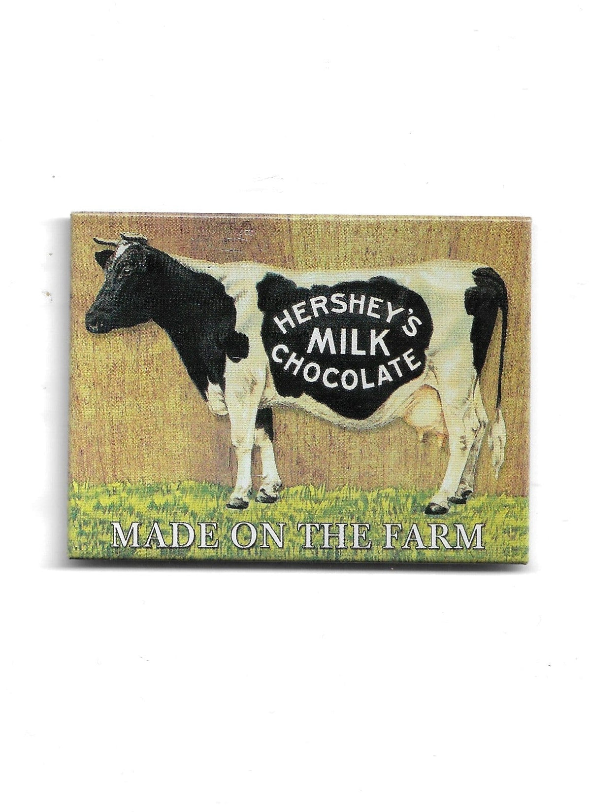 „Rechteckiger Kühlschrankmagnet ‚Hershey’s Milk Chocolate – Made on the Farm‘; farbig bedrucktes, stabiles Blech; vollflächiger Magnet; geeignet zum Befestigen mehrerer Notizzettel.“