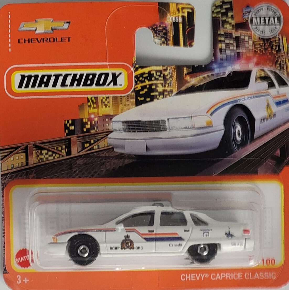 Matchbox Chevy Caprice Classic Police Canada Modell 32/100, blau‑weiß, Metall‑Druckguss, ca. 6,5×3×2,5–3,5 cm – neues Sammlermodell in OVP im Maßstab 1:64.