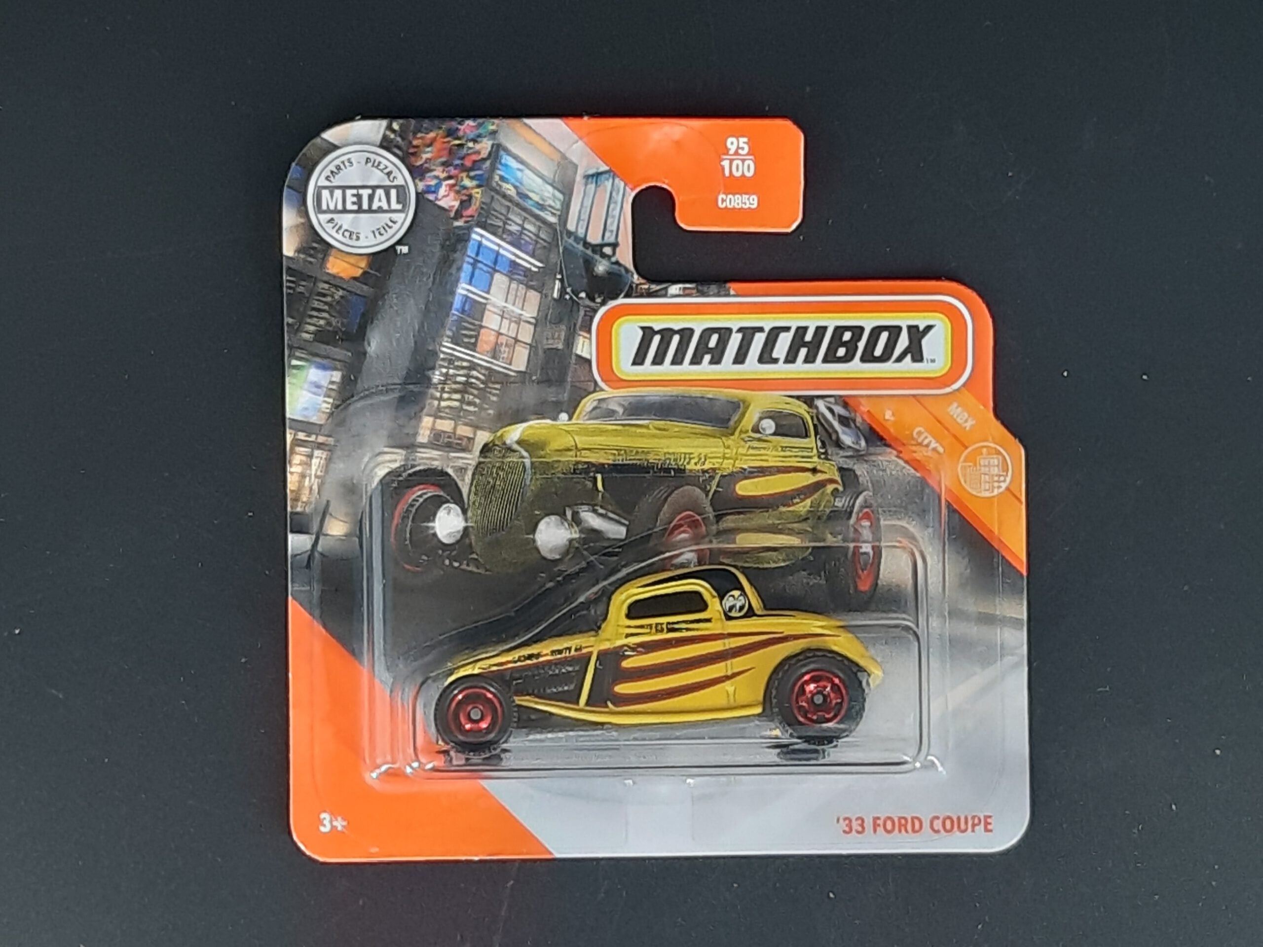 Matchbox Ford Coupé 1933 MBX City 27/100, gestreifter Metall‑Druckguss, ca. 6,5×3×2,5–3,5 cm – neues Sammlermodell in OVP im Maßstab 1:64.