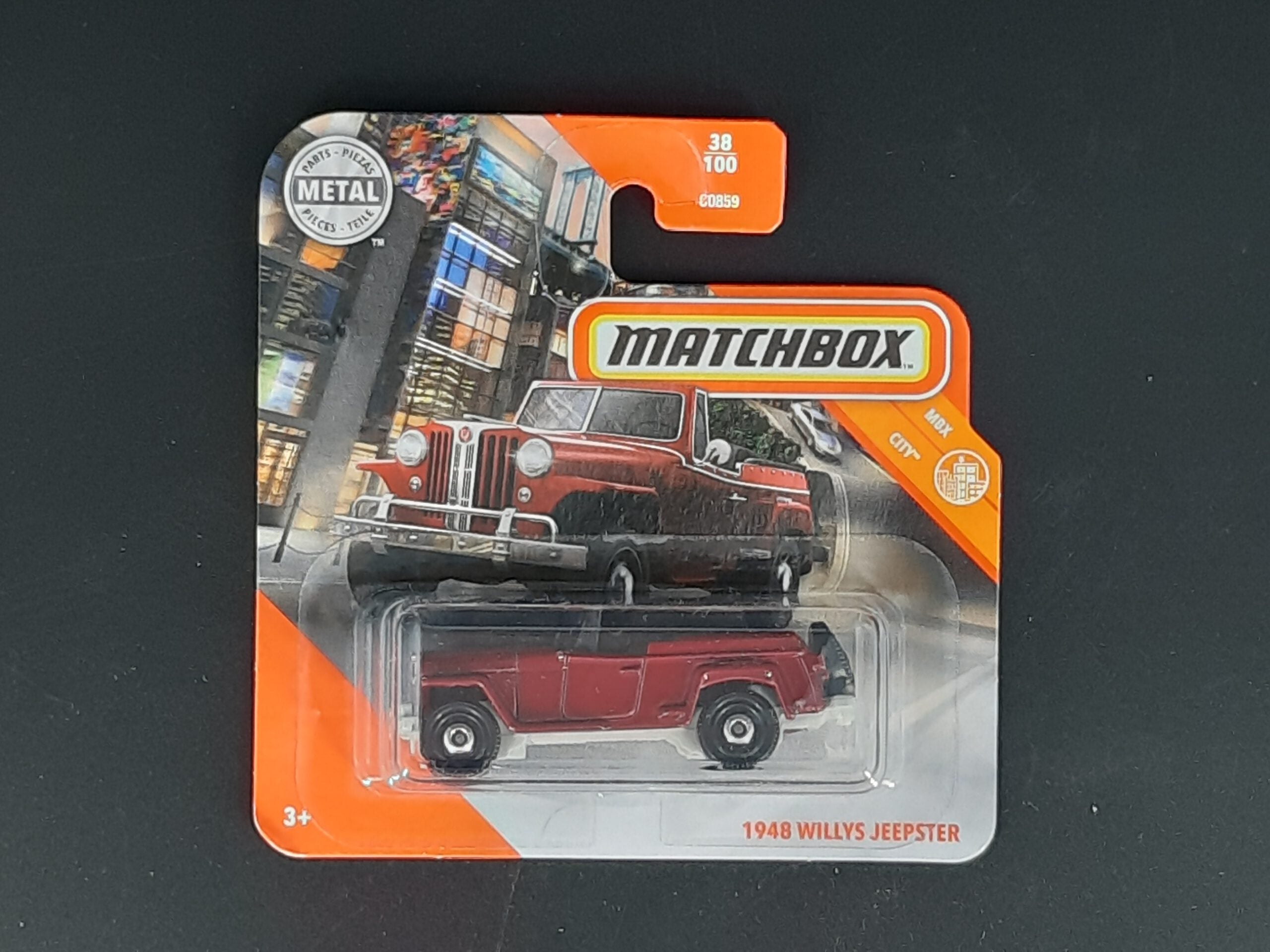 Matchbox Willys Jeepster 1948 MBX City 38/100, roter Metall‑Druckguss, ca. 6,5×3×2,5–3,5 cm – neues 1:64‑Sammlermodell in OVP.