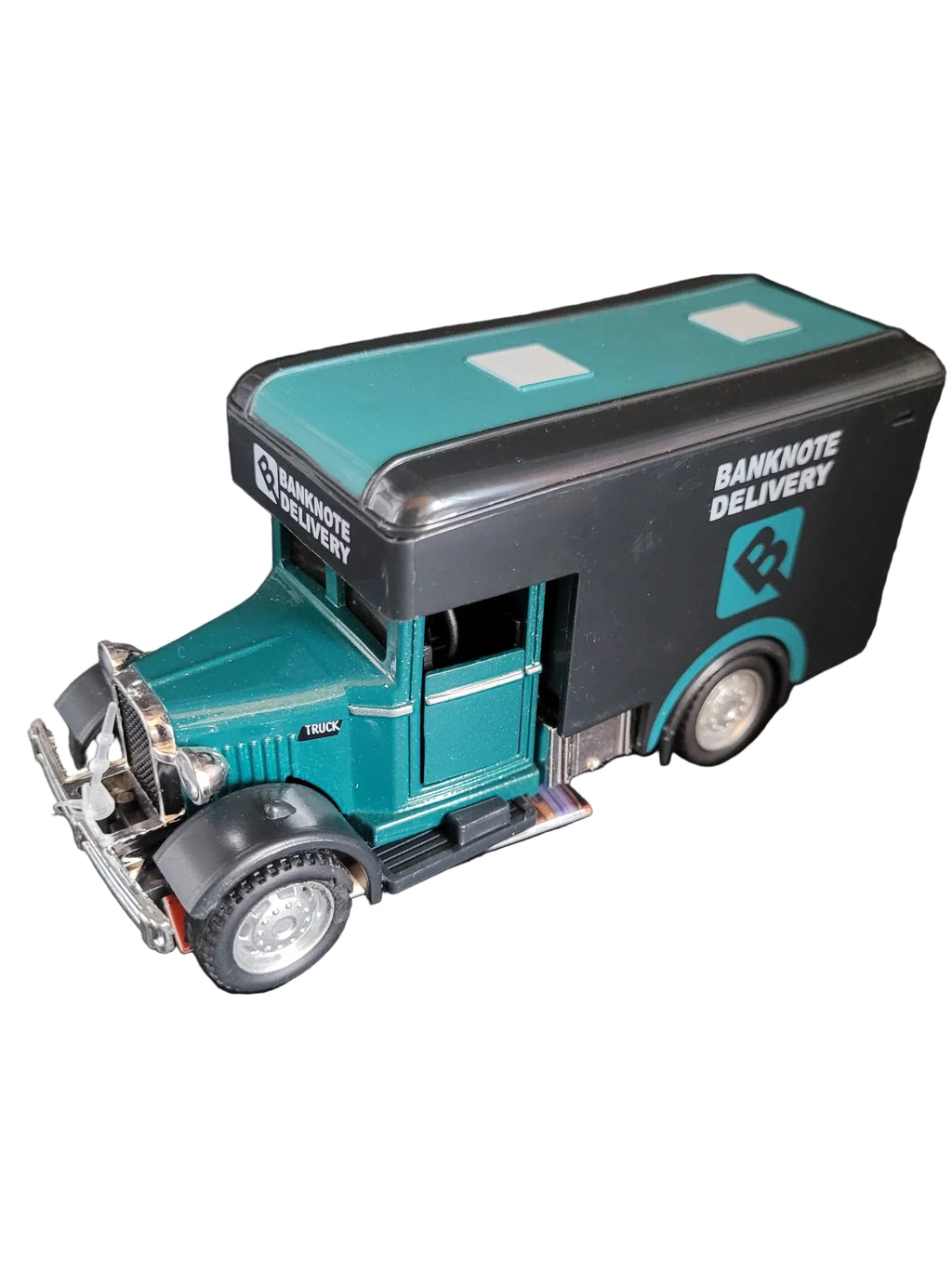 „Grüner Classic‑Oldtimer‑Ford‑LKW im Maßstab 1:36, etwa 13 × 5 × 6 cm groß, aus Metall mit Kunststoffteilen und Friktionsmotor. Das Modell zeigt typische Details eines historischen Ford‑Trucks.“