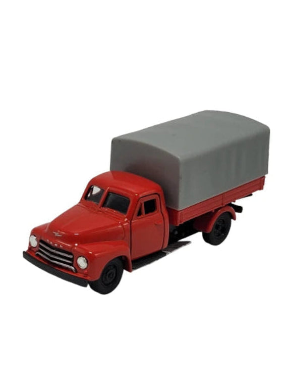 „Rotes Modellauto Opel Blitz 1952 von Welly im Maßstab 1:34–1:39, etwa 12 × 4 × 5,5 cm groß, aus Metall‑Spritzguss mit Kunststoffteilen. Das Miniaturfahrzeug zeigt typische Details des historischen Opel‑LKWs und ist ein nostalgisches Sammlerstück.“