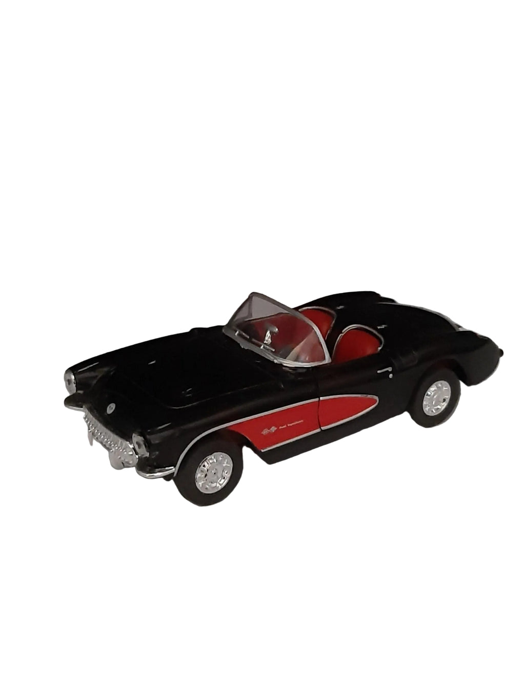 „Schwarzes Modellauto Chevrolet Corvette Cabrio Baujahr 1957 im Maßstab 1:36, aus Metall und Kunststoff, etwa 12 × 5 × 4 cm groß. Das Miniaturauto zeigt klassische Linien und Chromdetails der 1950er‑Jahre und besitzt einen Friktionsmotor.“ 