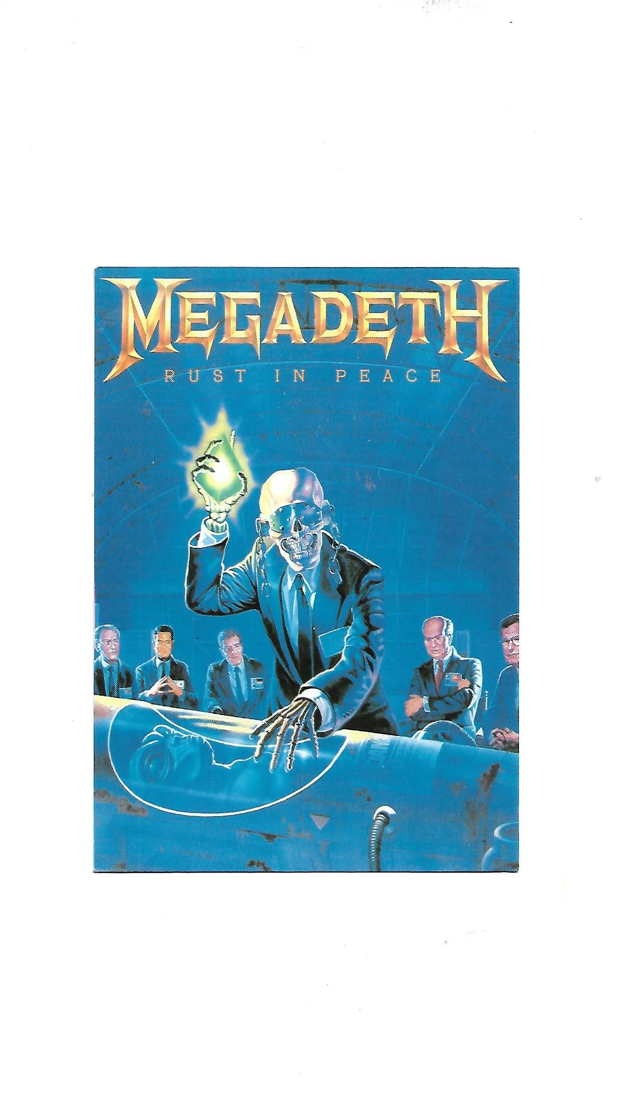 „Postkarte A6 ‚Megadeth – For Sale 1991‘; stabiles Papier, satte Farben, gute Druckqualität, Format 10,5 × 14,8 cm, Rückseite leicht fleckig, 8 g, Hersteller Winterland Productions / Rock Express“