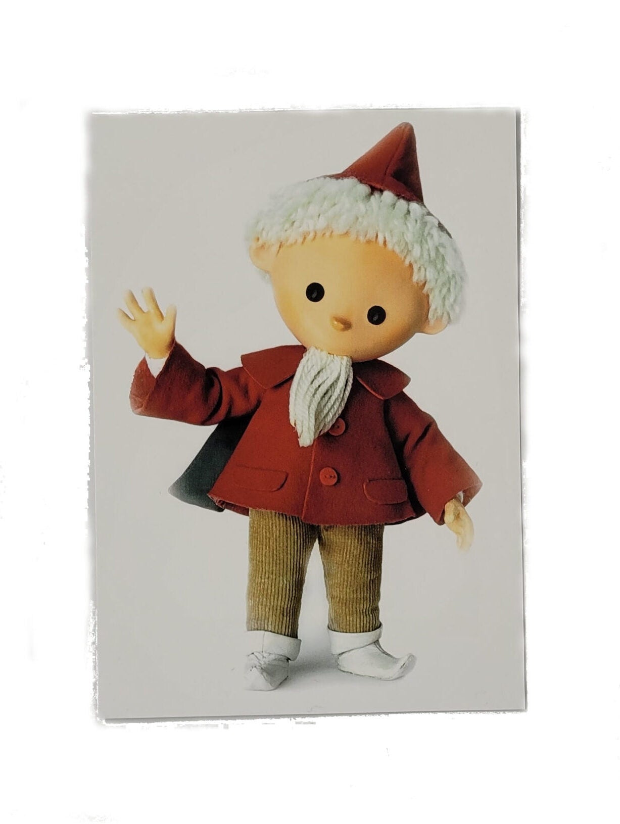 „Postkarte A6 ‚Sandmännchen winkend‘; stabiles Papier, satte Farben, gute Druckqualität, Format 10,5 × 14,8 cm, neu, EAN 4030576503304, Hersteller Anderskartig – Modern Times GmbH.“