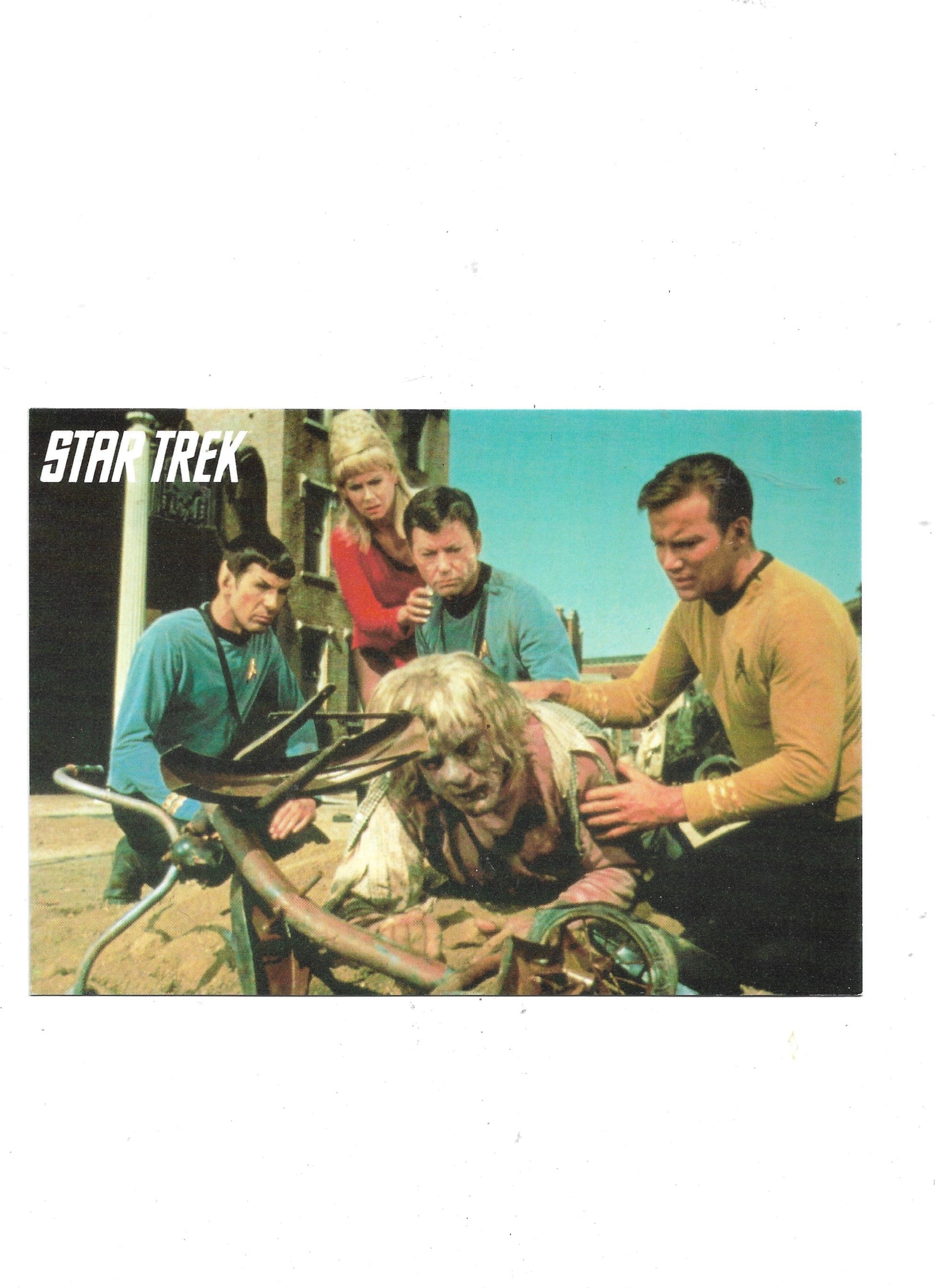„Postkarte A6 ‚Star Trek – Kirk, Pille & Spock‘; sehr guter Zustand, 9,5 × 14,5 cm, stabile Druckqualität, satte Farben, Papier, Retro/Vintage‑Stil, ohne EAN, M + V Marketing Verlags GmbH, Wuppertal, 1994.“ 