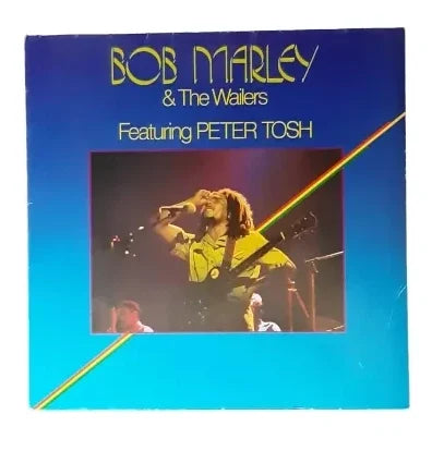 „Albumcover von Bob Marley mit ikonischem Porträt des Reggae-Stars, umgeben von warmen Farben und typischer Rastafari-Symbolik.