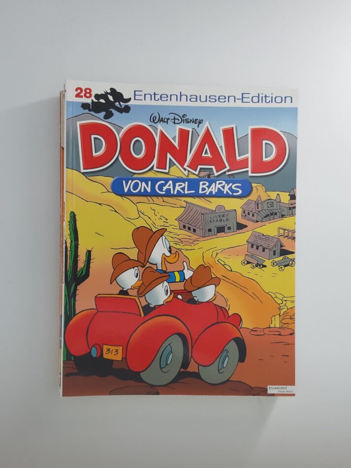 Comic „Donald – Entenhausen-Edition Band 28“ von Carl Barks, Softcover-Ausgabe aus dem Ehapa Verlag, nostalgisches Cover mit Donald Duck und seinen Neffen im roten Autoneuwertiger Zustand.